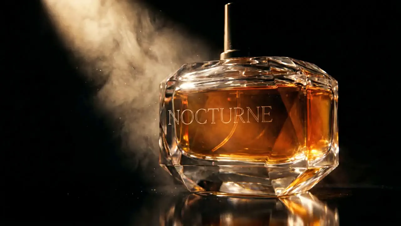 A single crystal flacon of NOCTURNE caught in a shaft of moonlight.